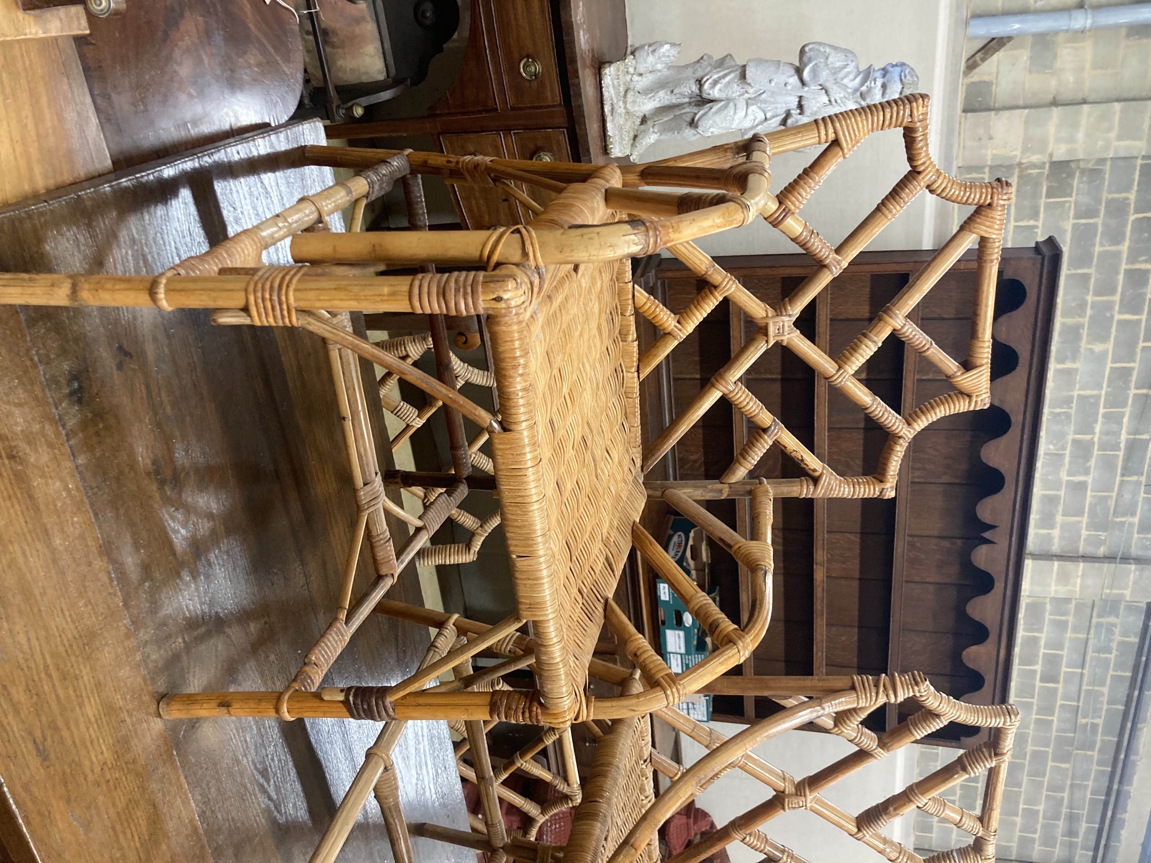 A set of nine caned bamboo chairs, five with arms